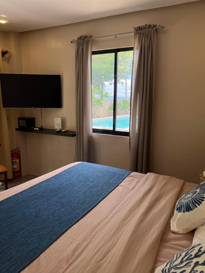 Southseas Beach Resort And Dive Center Santander Esterno foto