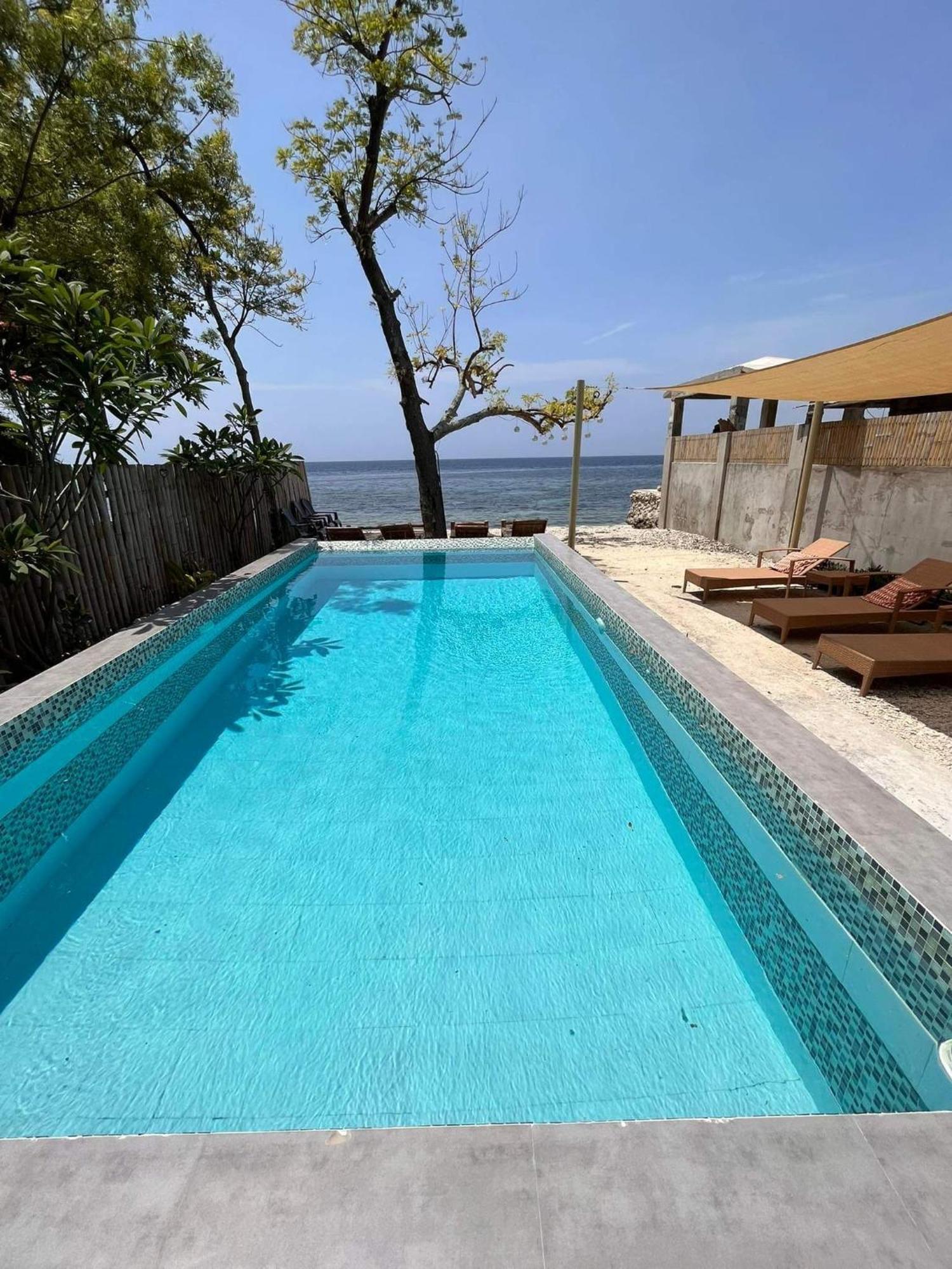 Southseas Beach Resort And Dive Center Santander Esterno foto
